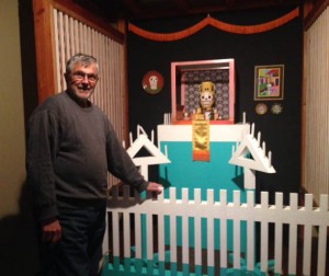Gus Foster standing by Ken Price shrine from the Highlights from the Gus Foster Collection exhibition